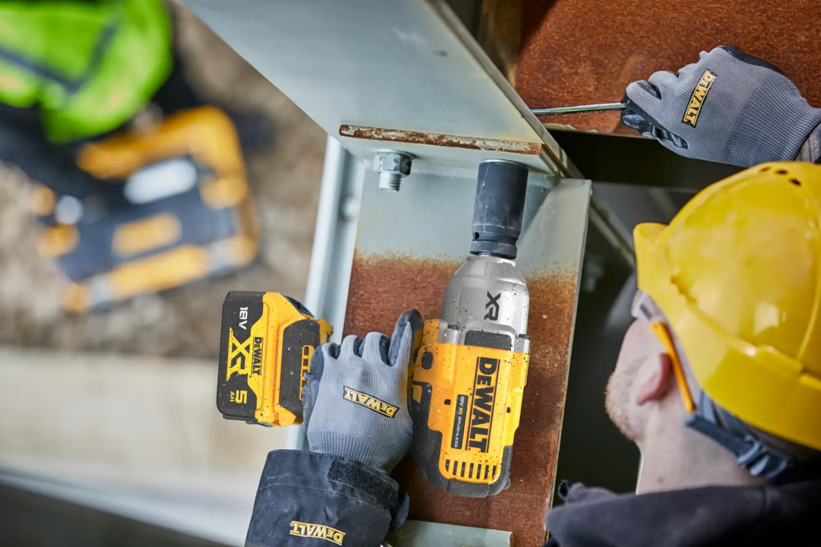 DEWALT DCF900NT-XJ DCF900NT tools used by workers on site, with gloves and helmet, Photography category.