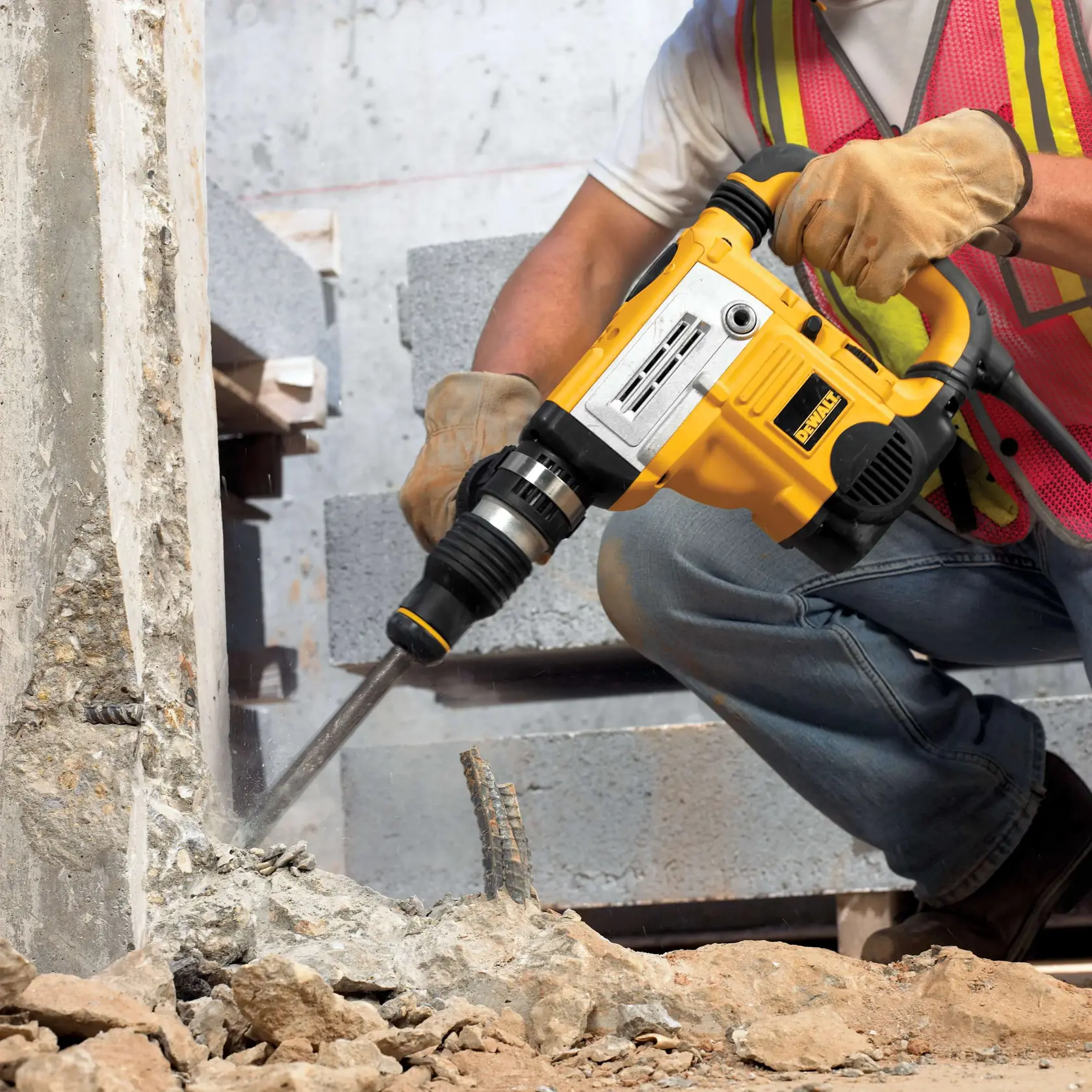 DEWALT DT8087, DT8087-QZ drill in use on concrete at a construction site. Photography product category.